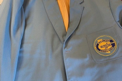 Chamber of Commerce coat with COC logo patch in gold