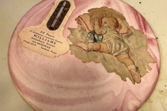 Williams Ambulance Service Round pink plaster plaque with thermometer
