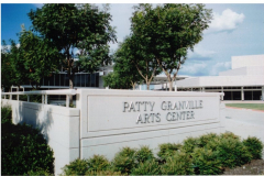 Patty Granville Arts Center sign with buildings in background, 2005