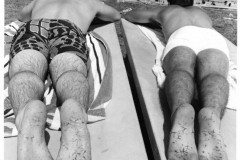 "Sunseekers" - two male sunbathers at Holford Pool, 1971