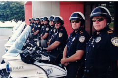 Motorcycle police officers lined up outside the Garland Performing Arts Center