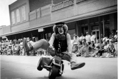 Shriners clown in parade at downtown square