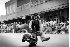 Shriners clown in parade at downtown square
