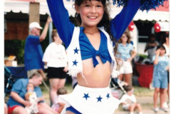 Star Spangled Fourth 1997 - Little girl dressed as Dallas Cowboys cheerleader in parade