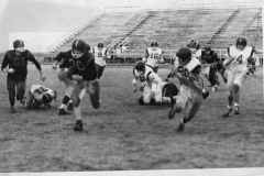 Football players at Williams Stadium circa 1970. #30 with the football is Eddie Horstman.