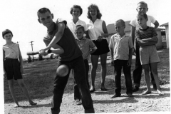 Children playing baseball circa 1970
