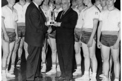 Graham Pierce presents trophy to R.B. Christian as team looks on - circa 1970