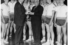 Graham Pierce presents trophy to R.B. Christian as team looks on - circa 1970