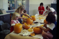 Children carving pumpkins for Halloween, Holford Park arts and crafts class, October 1977