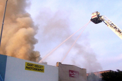 Fire at the Sew What Embroidery store in the downtown Garland Square. Originally Cannon Dry Goods. August 12, 2003 Gary Holley Photography