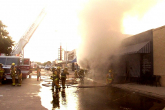 Fire at the Sew What Embroidery store in the downtown Garland Square. Originally Cannon Dry Goods. August 12, 2003 Plaza Theatre, State Street,
