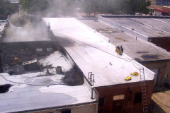 Fire at the Sew What Embroidery store in the downtown Garland Square.  Roof top view.  Originally Cannon Dry Goods. August 12, 2003