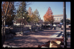 West side of square showing Corner Pocket Sandwich Shoppe, C.J.'s Ceramics, and Bobbie Sue's Gift Shop
