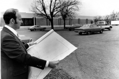 Lowell Lindsay, Head Librarian, looking at blueprints at Nicholson Memorial Library