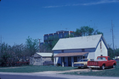 House on corner of Santa Fe and Ave C, First National Bank in the background