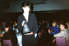 Cara Harting, Director of Community relations at an event with award