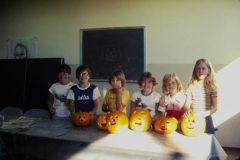 Children at Holford Park displaying their carved Halloween pumpkins - craft classes 1977.