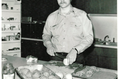 Fire fighter Robert Fultz preparing meal