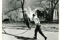 House fire with fire fighters in March 1967