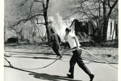 House fire with fire fighters in March 1967