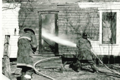 House fire with fire fighters in March 1967