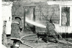 House fire with fire fighters in March 1967