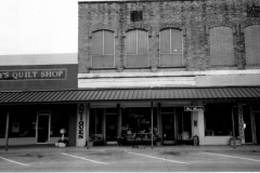 West Side of Square, L-R: Suzy's Quilt Shop located at 111 N. Sixth Street, Potpourri Cottage at 113 N. 6th Street, Tea Room upstairs from Potpourri Cottage, Antiques Store, now McGillicuddy's Antiques at 113 N. 6th Street