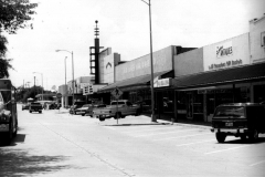 Looking west down Sixth Street. From east to west: Plaza Theatre--labeled in picture as Texas Opra House, then H.W. Jones Hardware Co., Books 'N Stuff, The Farmhouse Antiques, and Minuteman Press.