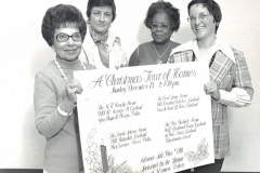 Members of the League of Women Voters with a poster for 'A Christmas Tour of Homes'. L-R: 1. Frances Brown 2. 3. 4.