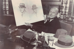 Harry Rolnick with sketches of Presidents Richard M. Nixon and John F. Kennedy in hats.
