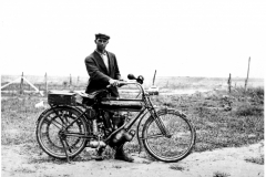 J.F. McLane & bicycle on Tucker farm